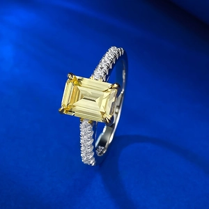 Detailed view of yellow cushion-cut center stone and S925 engraving on silver ring