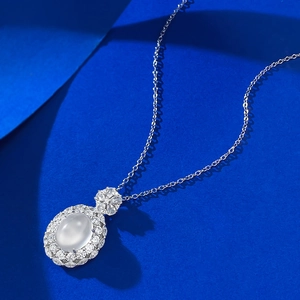 Elegant S925 silver necklace with oval water jasper gemstone pendant on blue background