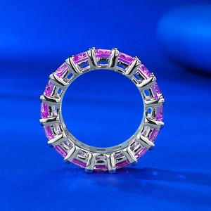 Elegant 925 silver eternity ring with emerald cut pink gemstones in claw setting