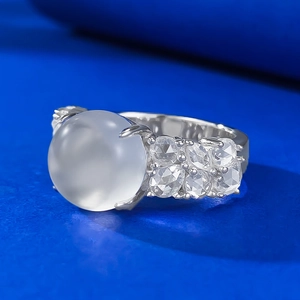 925 silver ring with large icy water jadeite cabochon and zircon side stones
