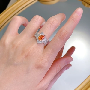 Exquisite 925 silver ring featuring a 2-carat pear-cut orange stone and pave diamonds