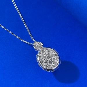 Detailed macro view of S925 sterling silver necklace pendant with hollow flower pattern