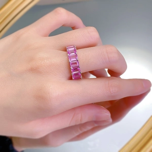 Close-up of S925 silver ring featuring rectangular pink gemstones in a pave setting