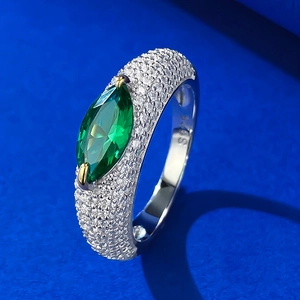 Close-up of S925 silver ring featuring marquise cut green gemstone and pavé stones