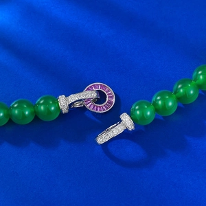 Close-up of S925 silver clasp with purple gemstone and green agate beads necklace