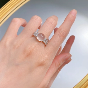 Elegant 925 silver ring with pink icy water jade cabochon and zircon accents on hand