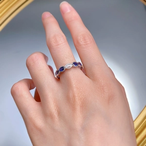 Detailed shot of an S925 silver ring with blue and white marquise-cut zirconia stones