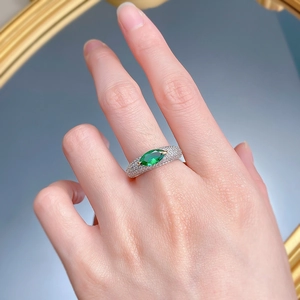 Detailed view of an S925 silver ring featuring a marquise-cut emerald-green stone and pavé gems