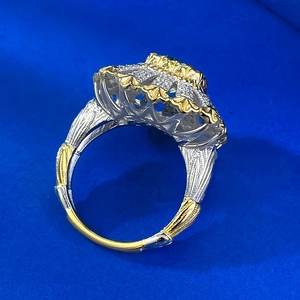 Macro detail of Buccellati style two-tone hollow floral silver ring with green stone