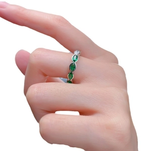 S925 sterling silver ring featuring marquise-cut green emerald stones in bezel setting