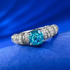 925 silver cushion cut blue gemstone ring with micro-pave side stones on velvet