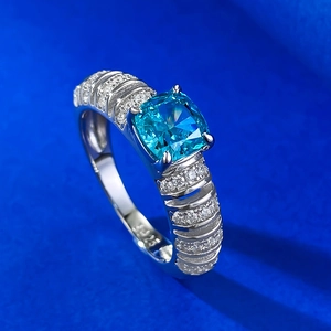 Luxury 925 silver ring with cushion-cut blue gemstone and shimmering micro-pave diamonds