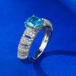 Luxurious 925 silver ring with cushion-cut blue gemstone and intricate pave setting
