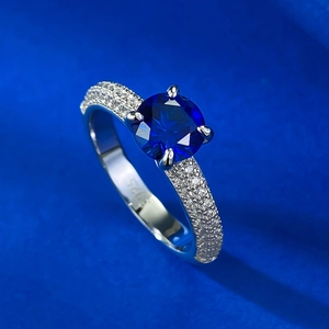 S925 sterling silver ring with 1 carat blue sapphire and pavé cubic zirconia accents
