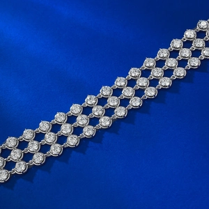 Detailed macro view of triple-row sparkling cubic zirconia silver-plated bracelet