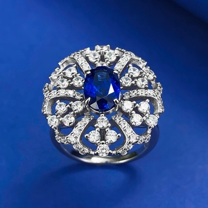 Elegant 925 sterling silver ring with oval royal blue gemstone and floral cubic zirconia