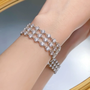 Elegant three-row silver sparkle tennis bracelet with round cubic zirconia on wrist