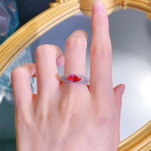Detailed close-up of S925 silver ring featuring marquise red stone and pavé diamonds