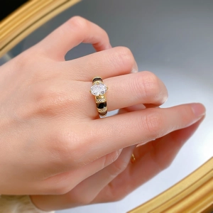 Close-up of S925 oval high carbon diamond ring with black enamel on a hand