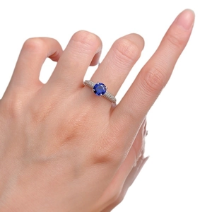 Luxury S925 silver ring featuring a 1-carat blue sapphire with halo diamond accents