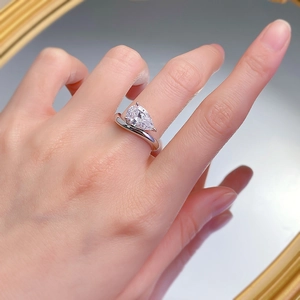 Elegant S925 silver ring with a 2-carat pear-cut solitaire diamond on a woman's finger