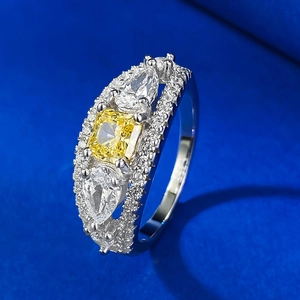 Three-stone ring with cushion-cut yellow zircon and pear-shaped white diamonds in silver