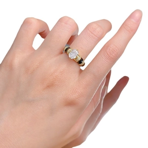 Elegant gold S925 silver ring with oval white stone and black enamel details