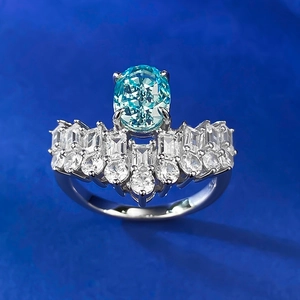 925 silver ring featuring an oval blue carbon diamond in a crown-style luxury setting