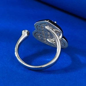 Close-up of intricate hollow-out cloud patterns on silver gourd ring back detail