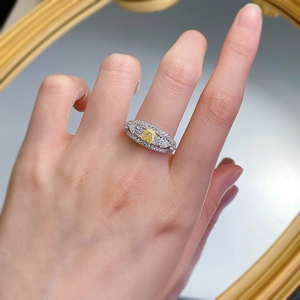 Luxurious S925 silver ring with yellow cushion-cut center stone on a person's finger