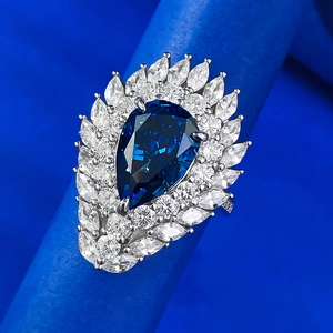 Elegant 925 sterling silver ring with a pear-cut royal blue stone and marquise accents