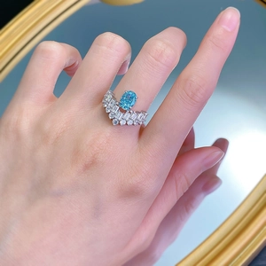 Elegant 925 silver ring with oval blue gemstone and crown-style baguette diamond setting
