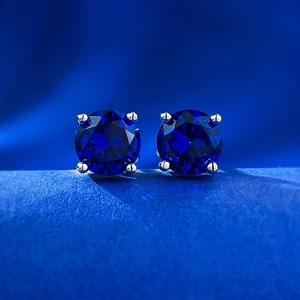 Classic S925 silver four-prong stud earrings featuring 1ct round deep blue stones