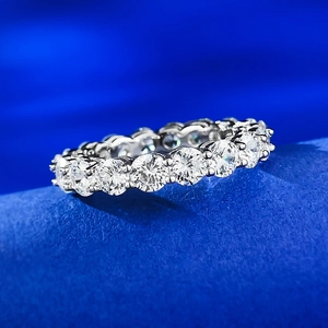 Macro view of S925 silver eternity ring with 4mm sparkling round cut stones