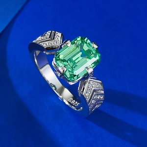 Vintage 925 silver ring featuring emerald cut green gemstone and pavé diamonds