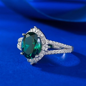 Luxurious S925 silver ring featuring a large oval emerald and pavé-set diamonds