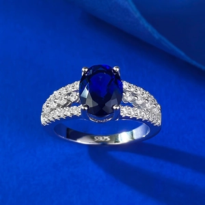 S925 sterling silver ring featuring a large oval blue sapphire stone and pavé diamonds