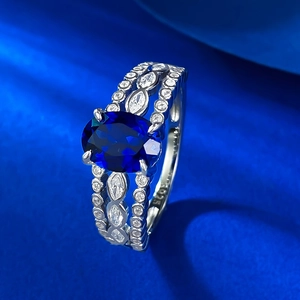 Elegant S925 silver ring with an oval blue gemstone and sparkling white accent stones