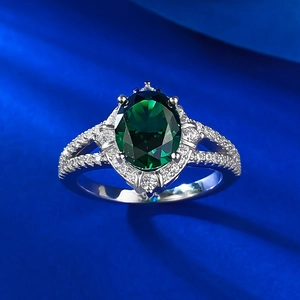 Halo style S925 sterling silver ring featuring a large emerald-cut green gemstone