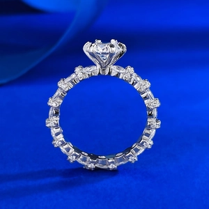 Classic S925 silver 1 carat round moissanite ring with six-prong setting on blue silk