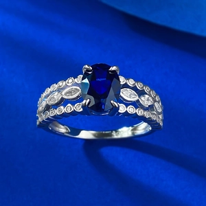 Elegant S925 silver ring with oval blue gemstone and hollow diamond-set band