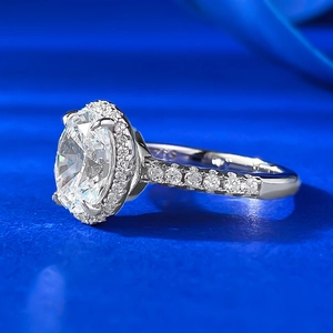 Classic S925 sterling silver halo ring with a large oval white stone and pavé diamond band