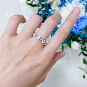 Close-up of S925 silver beaded eternity ring with sparkling cubic zirconia on a hand