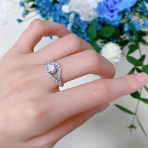 Macro view of a 925 sterling silver ring with a twisted band and a 1-carat round diamond