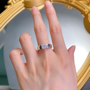 Close-up of S925 silver ring with a square-cut sparkling gemstone on a finger