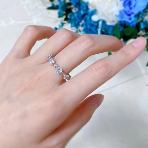 Close-up of a minimalist S925 silver beaded ring with sparkling zircons on a hand