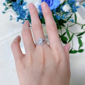 Detailed view of a 925 silver ring featuring a 1ct round center stone and a pavé band