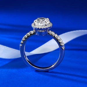 S925 silver halo ring with a large round center diamond and pavé side stones on blue