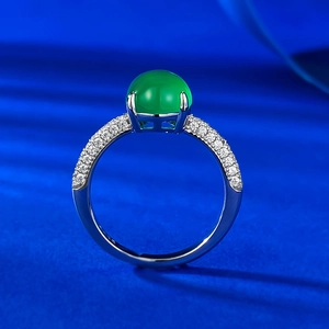 925 silver ring featuring a large green oval chalcedony and pavé set cubic zirconia