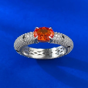 S925 sterling silver ring featuring an oval orange gemstone and pavé-set diamonds